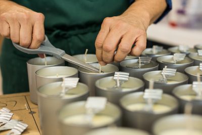 Closeup of person making homemade candles to sell